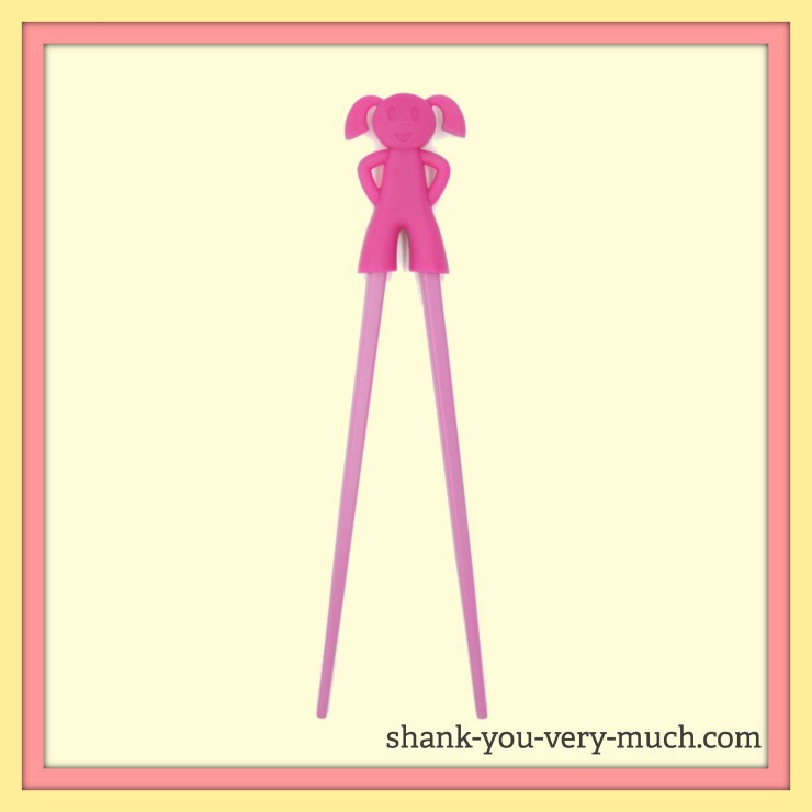 A picture of a rubber girl with two chopsticks for legs. The rubber girl allows the chopsticks to open and close.