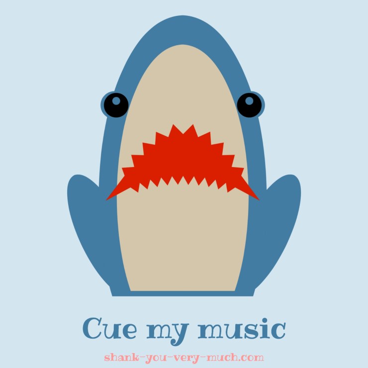 A cartoon shark who has his front half of the body out of the water and looking at you with his mouth open and the phrase 'cue my music' underneath him.